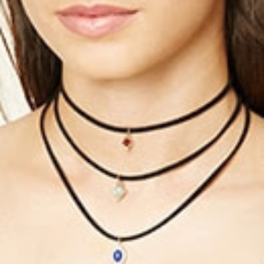 Set of suede chokers with a charm